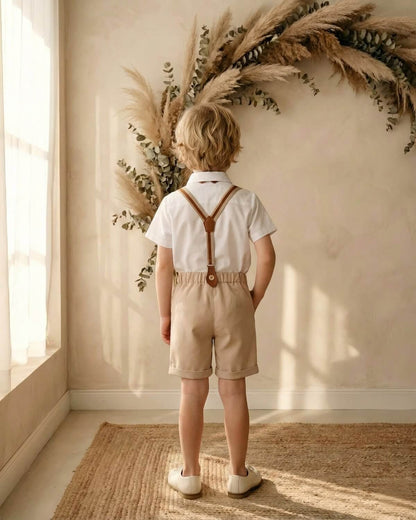 Back view of the boys formal wedding attire showing classic Y-back vintage suspenders attached to tailored beige shorts