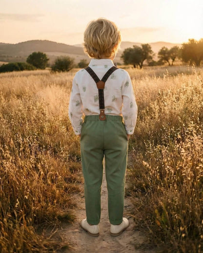 Back view of the boys wedding outfit showing the classic Y-back vintage suspenders attached to the sage green trousers