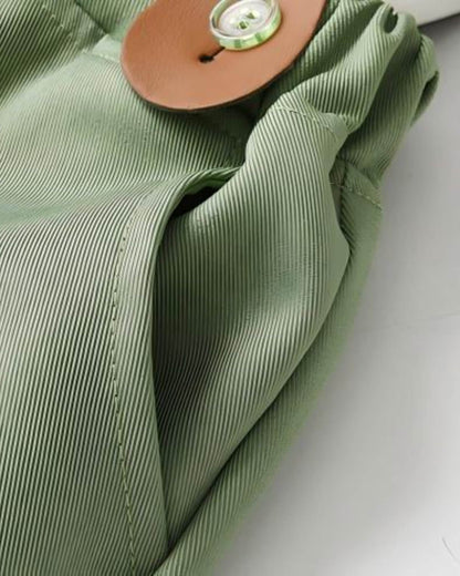 etailed view of boys sage green page boy suit pants featuring premium twill textured fabric and a functional side pocket