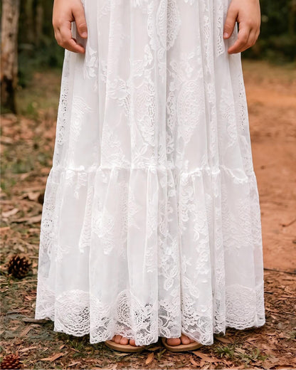 Detailed close-up shot of the premium tiered ruffle skirt and scalloped lace hemline.