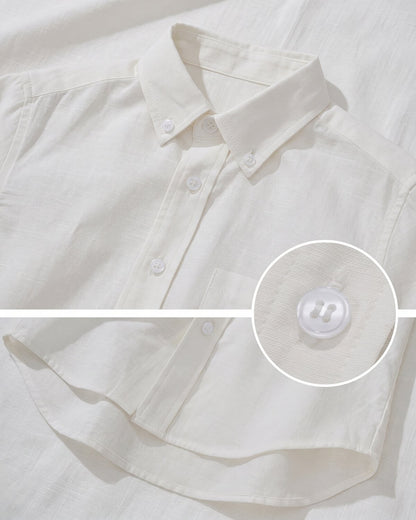Close-up view of a white boys' linen-cotton button-down dress shirt showing fabric texture and durable button detailing.