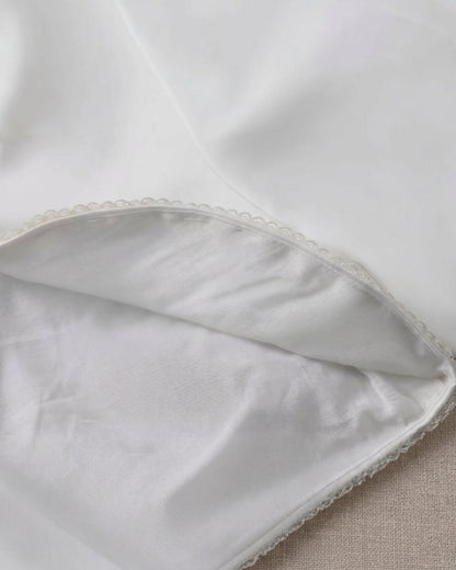Detailed inner view of the kids white satin formal bolero showing high-quality smooth interior lining and clean hemline craftsmanship.